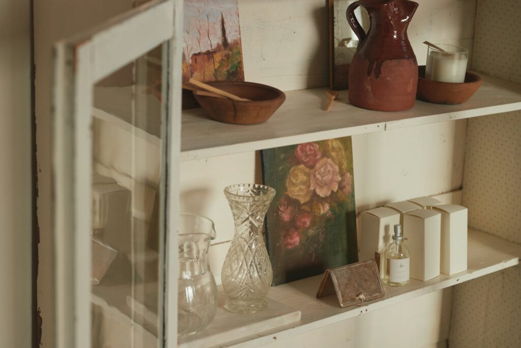 A shelf filled with vases and other items