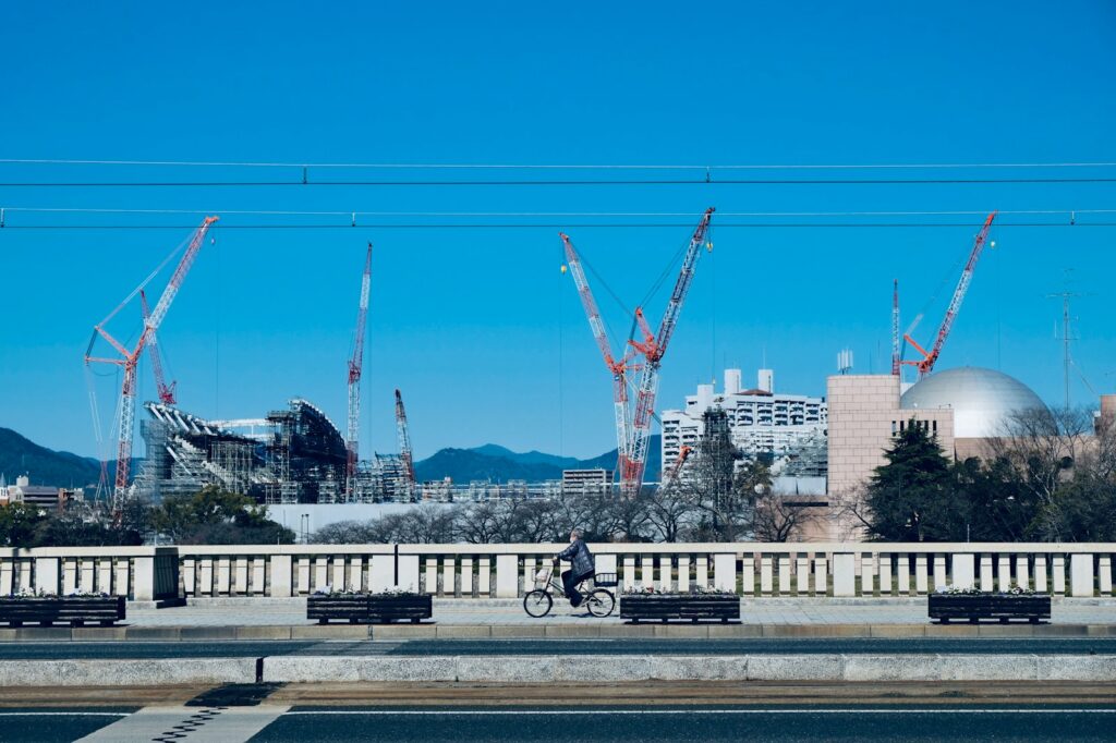 a person riding a bike on a bridge