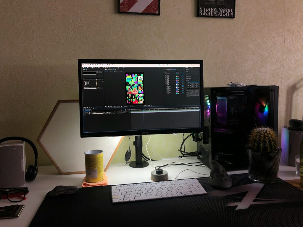 black flat screen computer monitor on white computer desk