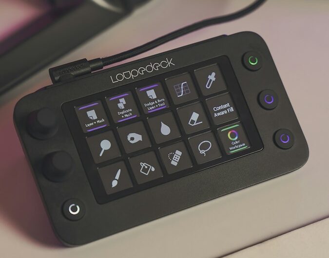 a computer keyboard sitting on top of a desk